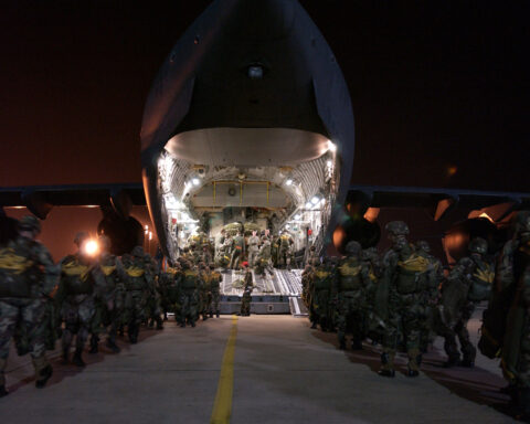 US Army 82nd Airborne Division paratroopers boarding a C-17 Globemaster III for night deployment. Photo: US Department of Defense / Public Domain
