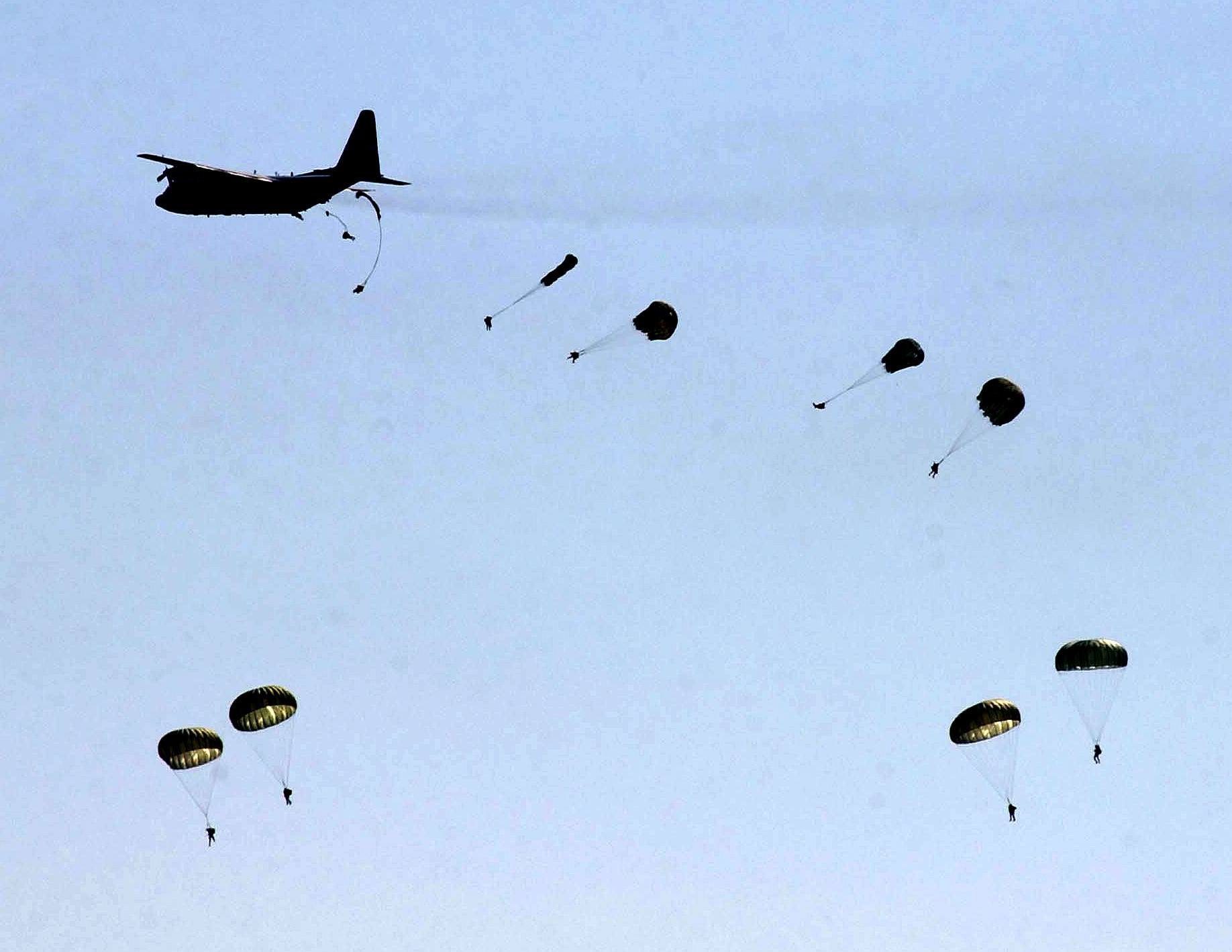 82nd Airborne Division paratroopers jump from a C-130 transport aircraft during a deployment exercise. Photo: US Army / Public Domain
