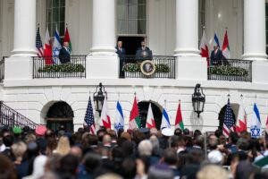 Abraham Accords signing ceremony at the White House with Israeli and Arab leaders flanked by national flags, September 2020. Photo: White House / Public Domain