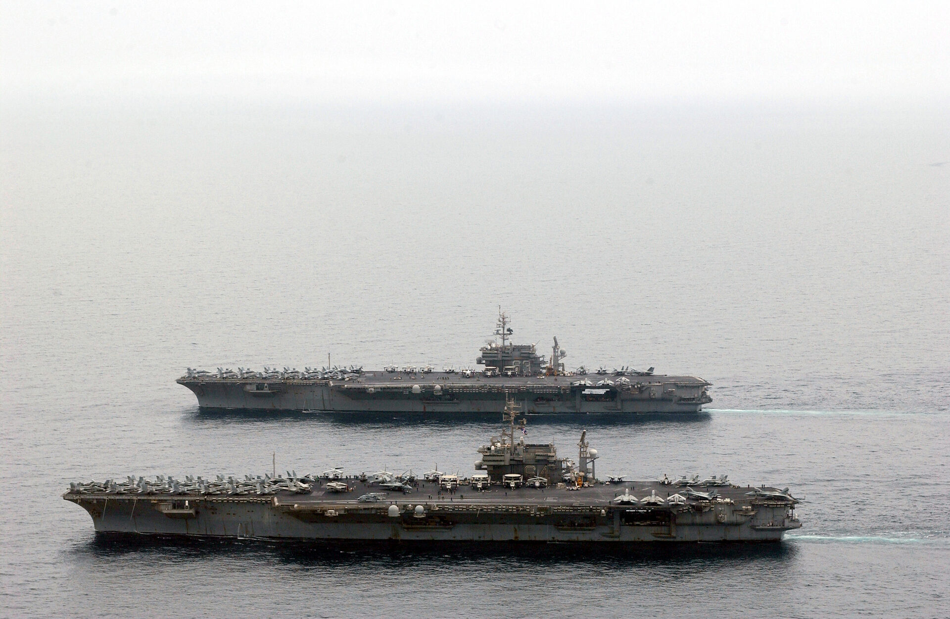 USS Kitty Hawk and USS Constellation aircraft carriers underway together in the Arabian Gulf