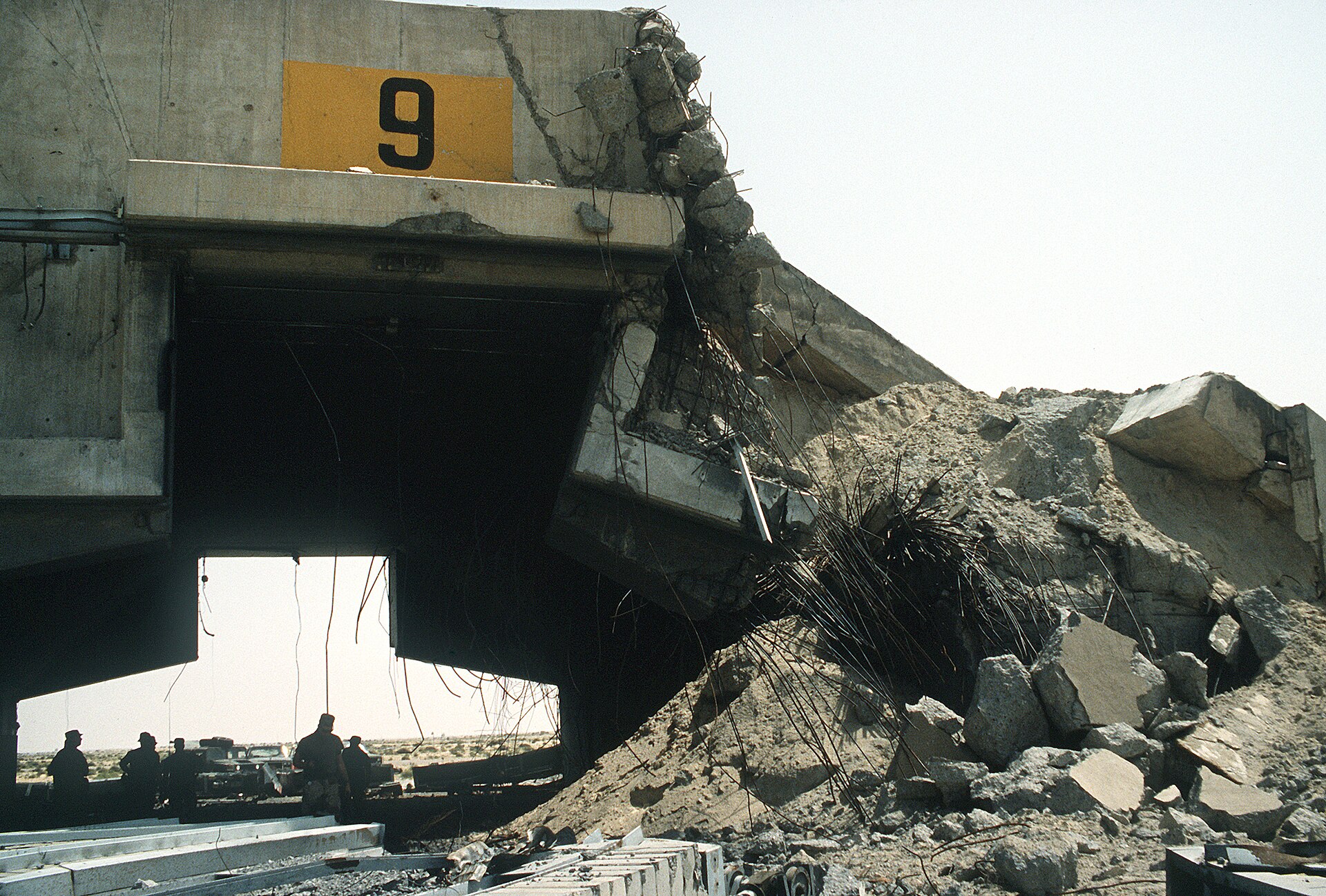 A damaged hardened aircraft shelter at Ali Al Salem Air Base in Kuwait. Photo: US Department of Defense / Public Domain
