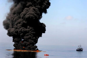 Thick black smoke and flames rising from a fuel fire on water in the Persian Gulf region. Photo: US Navy / Public Domain