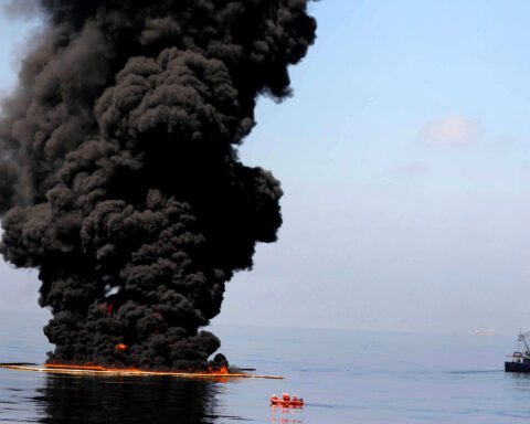 Thick black smoke and flames rising from a fuel fire on water in the Persian Gulf region. Photo: US Navy / Public Domain