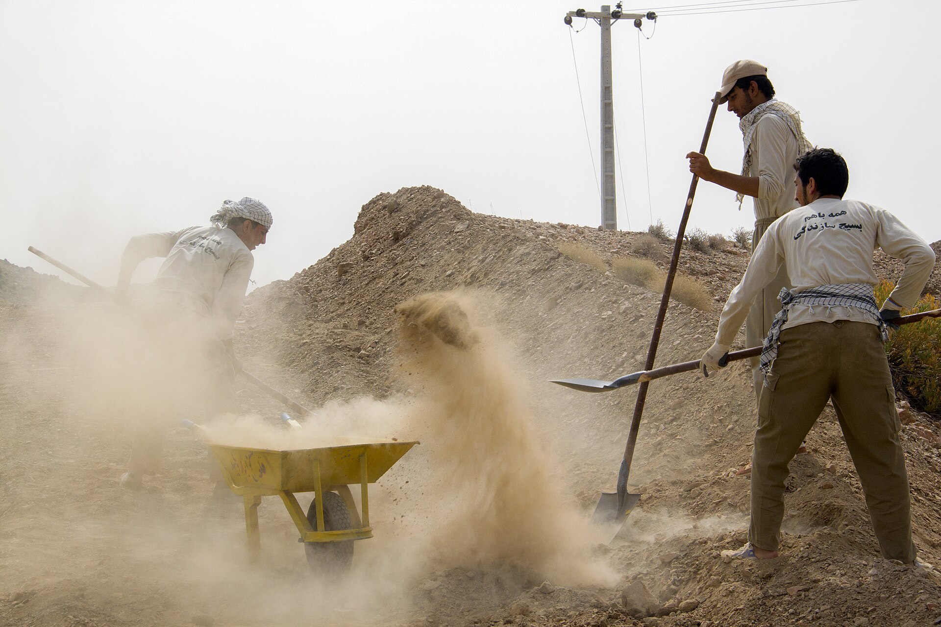 Members of Iran's Basij paramilitary militia engaged in construction work in a rural area. The Basij force commander Gholamreza Soleimani was reportedly killed in an Israeli airstrike on March 17 2026. Photo: Wikimedia Commons / CC BY-SA 4.0