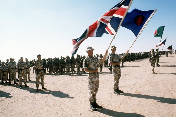 Coalition troops from multiple nations with national flags gathered in Saudi Arabia during Operation Desert Storm, the last major military coalition on Saudi soil. Photo: US Department of Defense / Public Domain