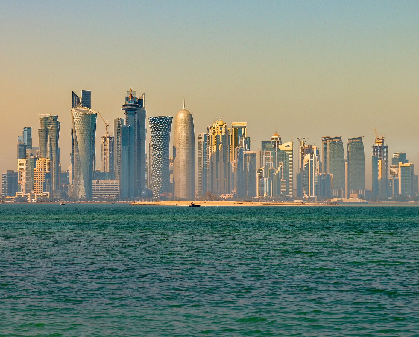 The Doha skyline seen from across the water, the capital of Qatar which expelled Iranian military attaches after missile strikes on its gas infrastructure in March 2026. Photo: Wikimedia Commons / CC BY 2.0