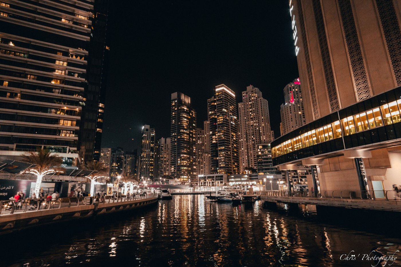 Dubai Marina skyline at night showing densely populated residential towers and commercial areas that have come under Iranian drone and missile fire since February 2026. Photo: Wikimedia Commons / CC BY 3.0