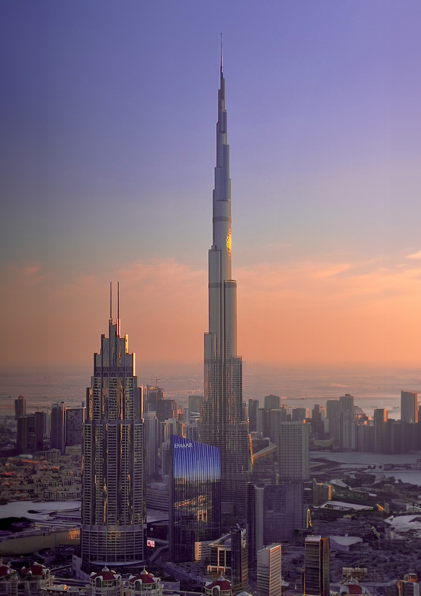Dubai skyline at sunset with Burj Khalifa towering over the city