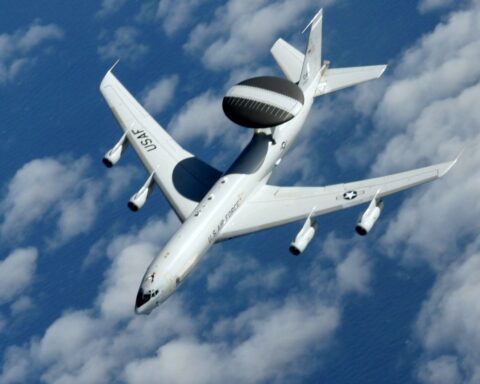 U.S. Air Force E-3 Sentry AWACS aircraft in flight showing its distinctive rotating radar dome mounted above the fuselage