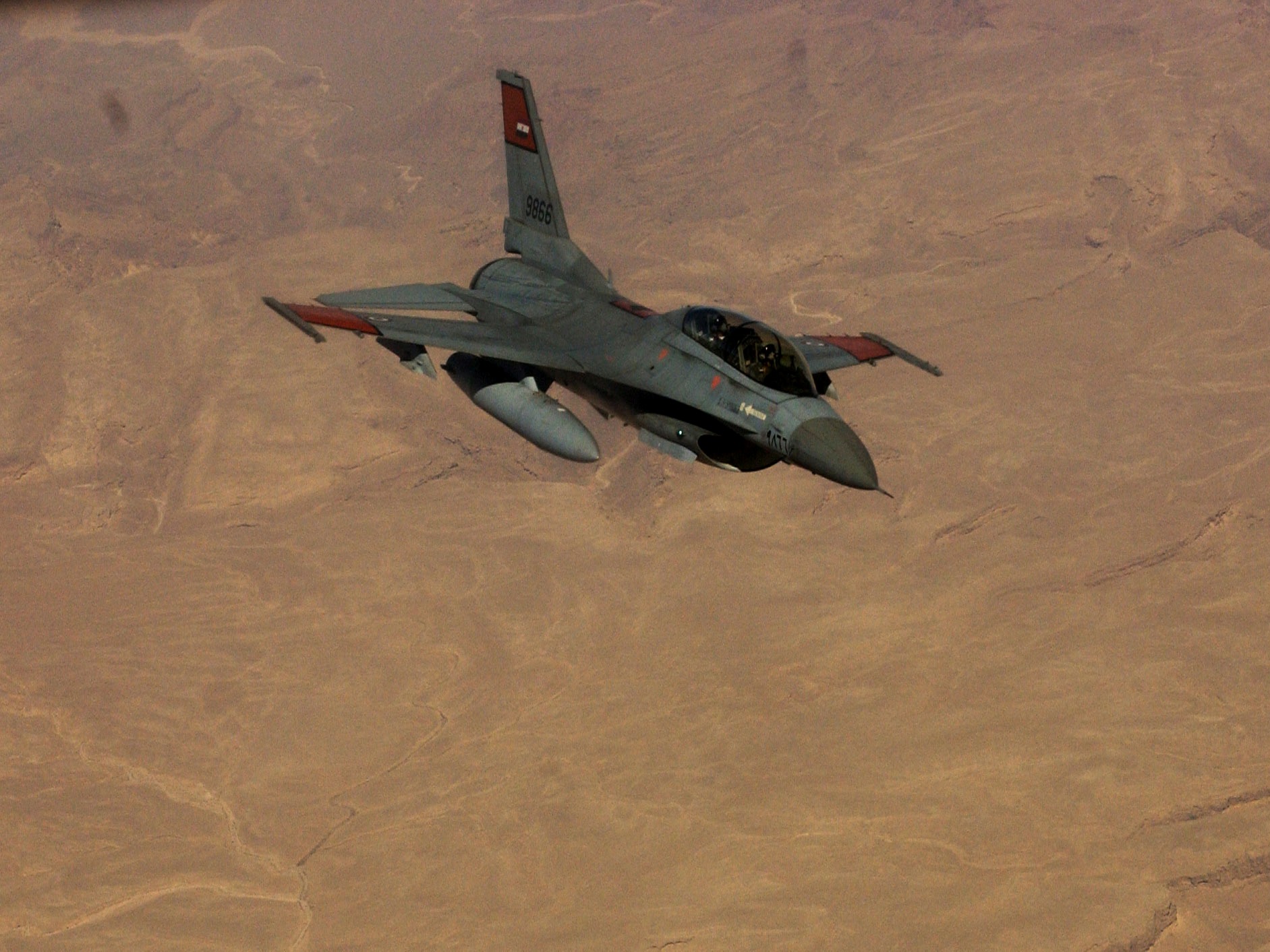 An Egyptian Air Force F-16 Fighting Falcon flies over desert terrain, showcasing Egypt's 220-strong fleet of American-built multirole fighters. Photo: US Air Force / Public Domain
