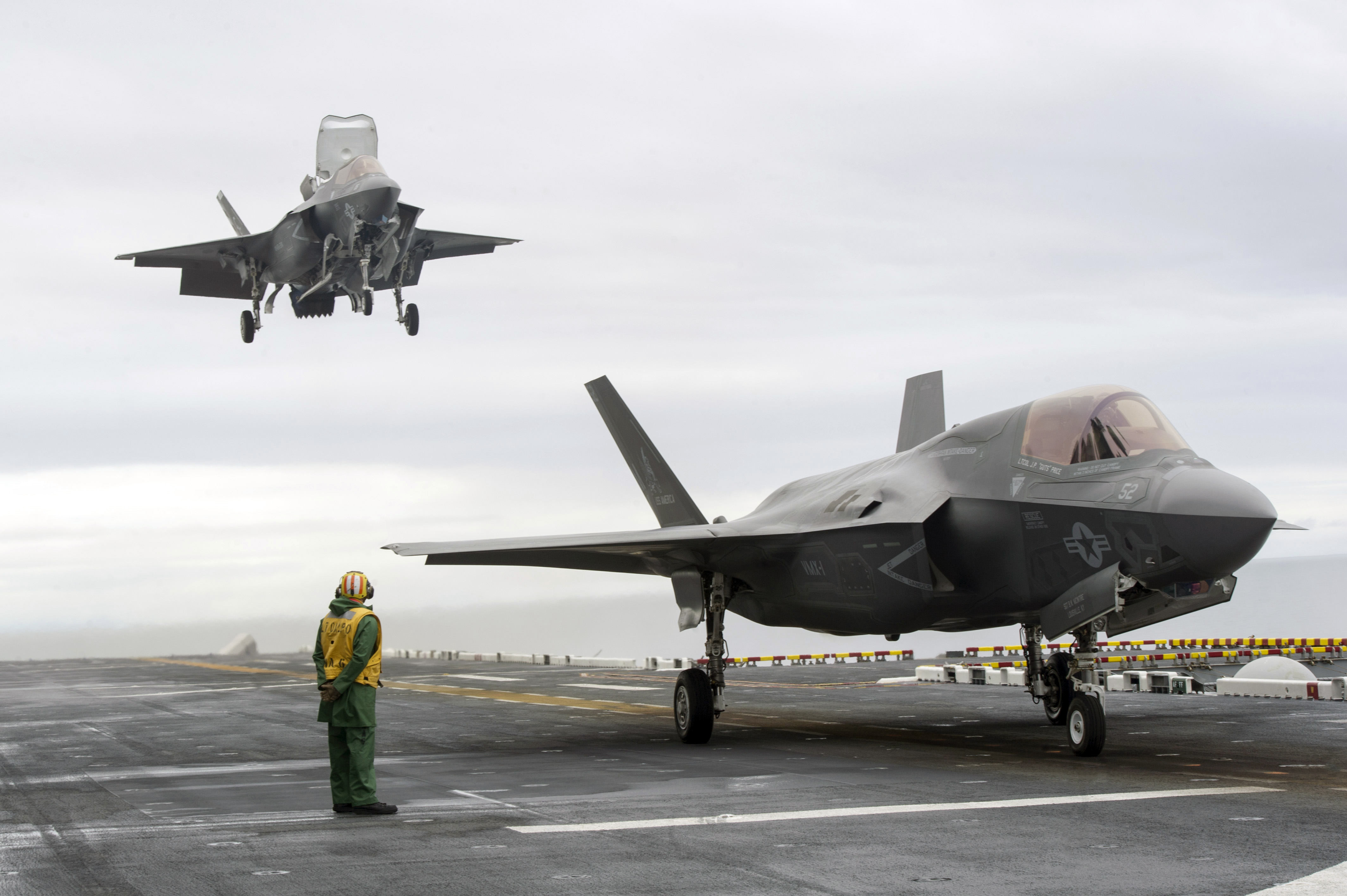 Two F-35B Lightning II stealth fighters land on the flight deck of an amphibious assault ship, the same aircraft type deploying with the 31st MEU to the Gulf. Photo: US Navy / Public Domain