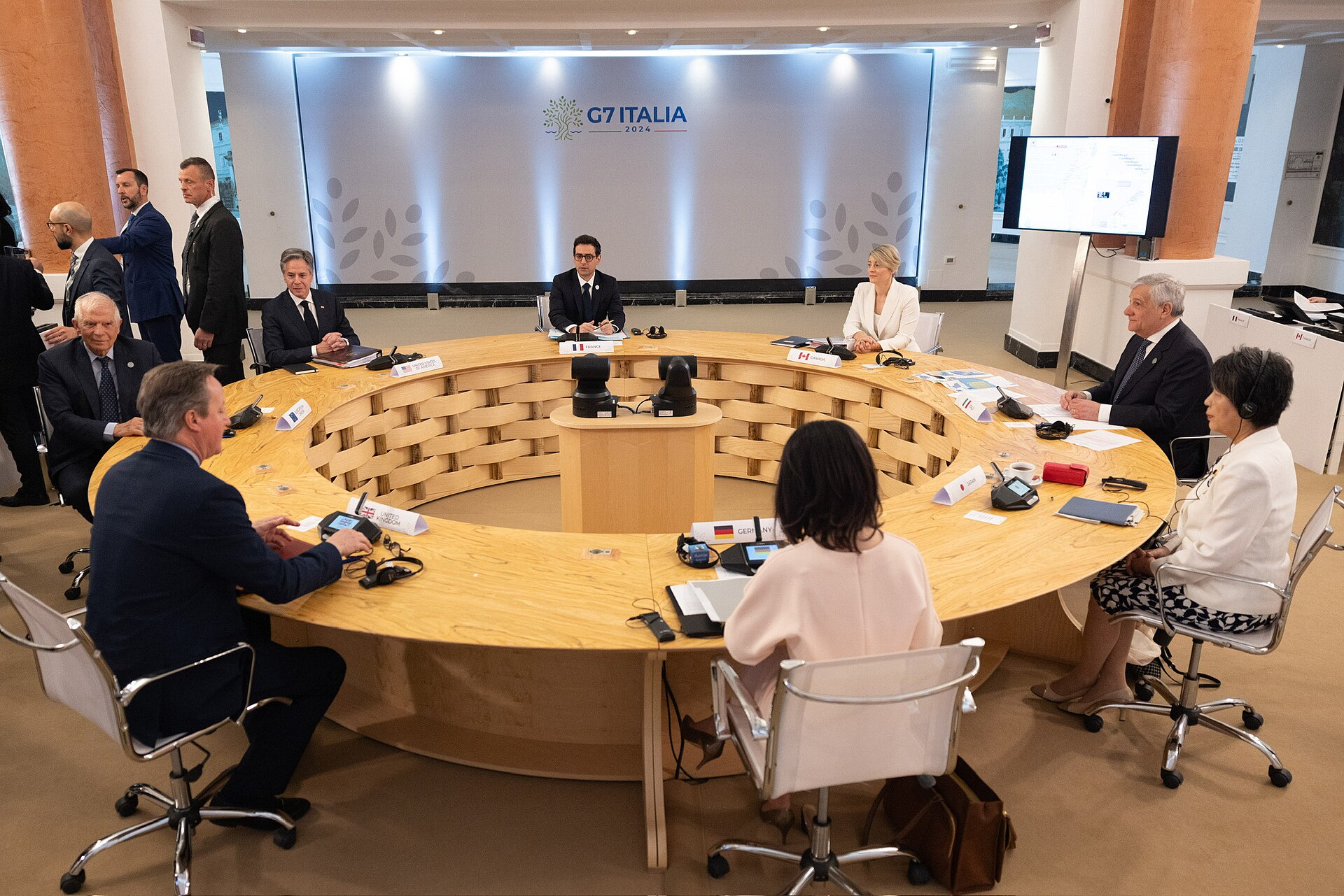 G7 foreign ministers seated around a circular table during a working session at the Capri summit in Italy