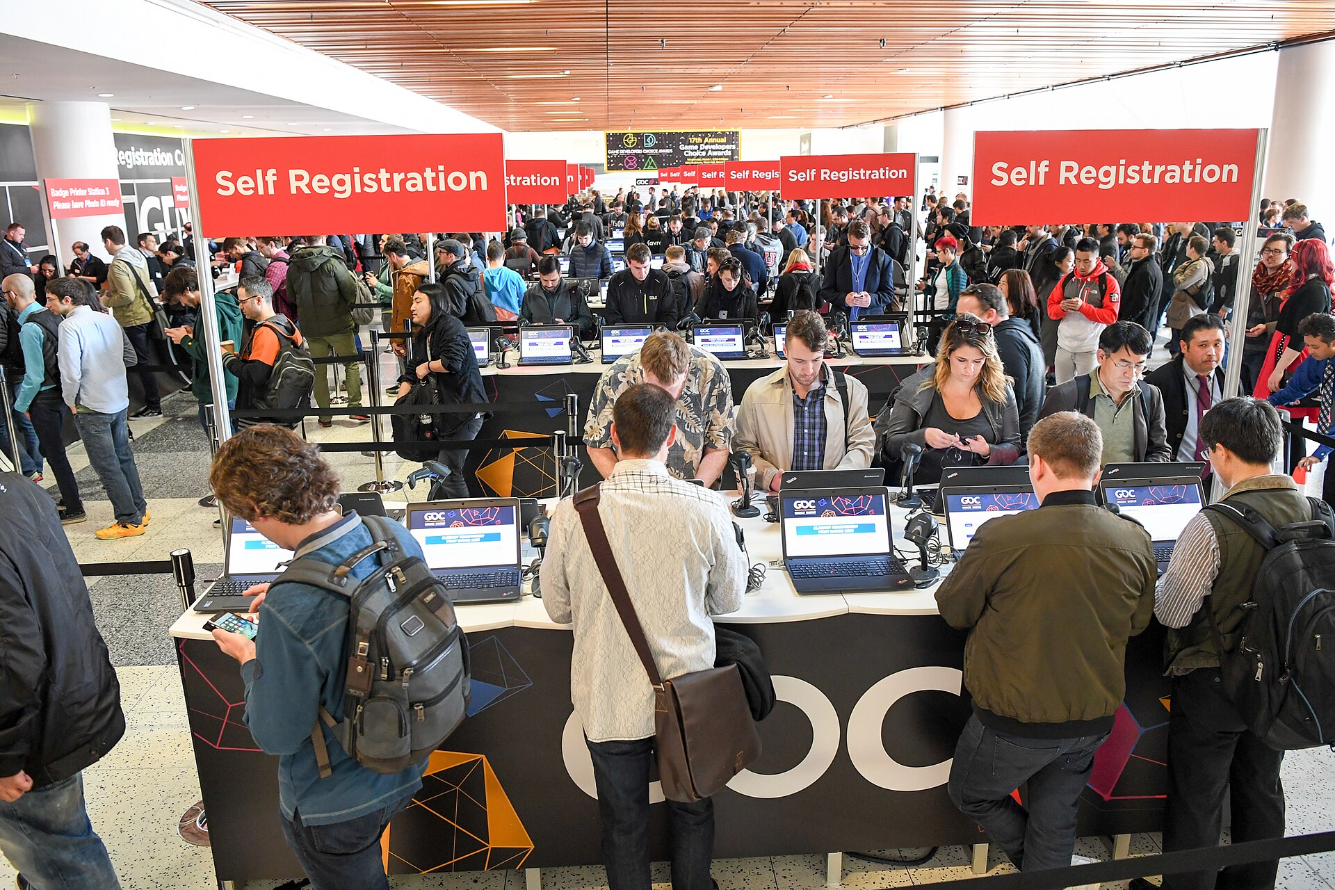 Attendees crowd the registration area at the Game Developers Conference in San Francisco, where Savvy Games CEO Brian Ward addressed the impact of the Iran war on Saudi gaming ambitions