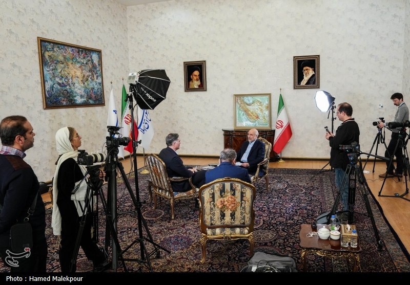 Mohammad Bagher Ghalibaf, Speaker of Iran's parliament, during a CNN interview in Tehran with Iranian flags and portraits of Khomeini and Khamenei in the background. Photo: Hamed Malekpour / Tasnim News / Wikimedia Commons / CC BY 4.0