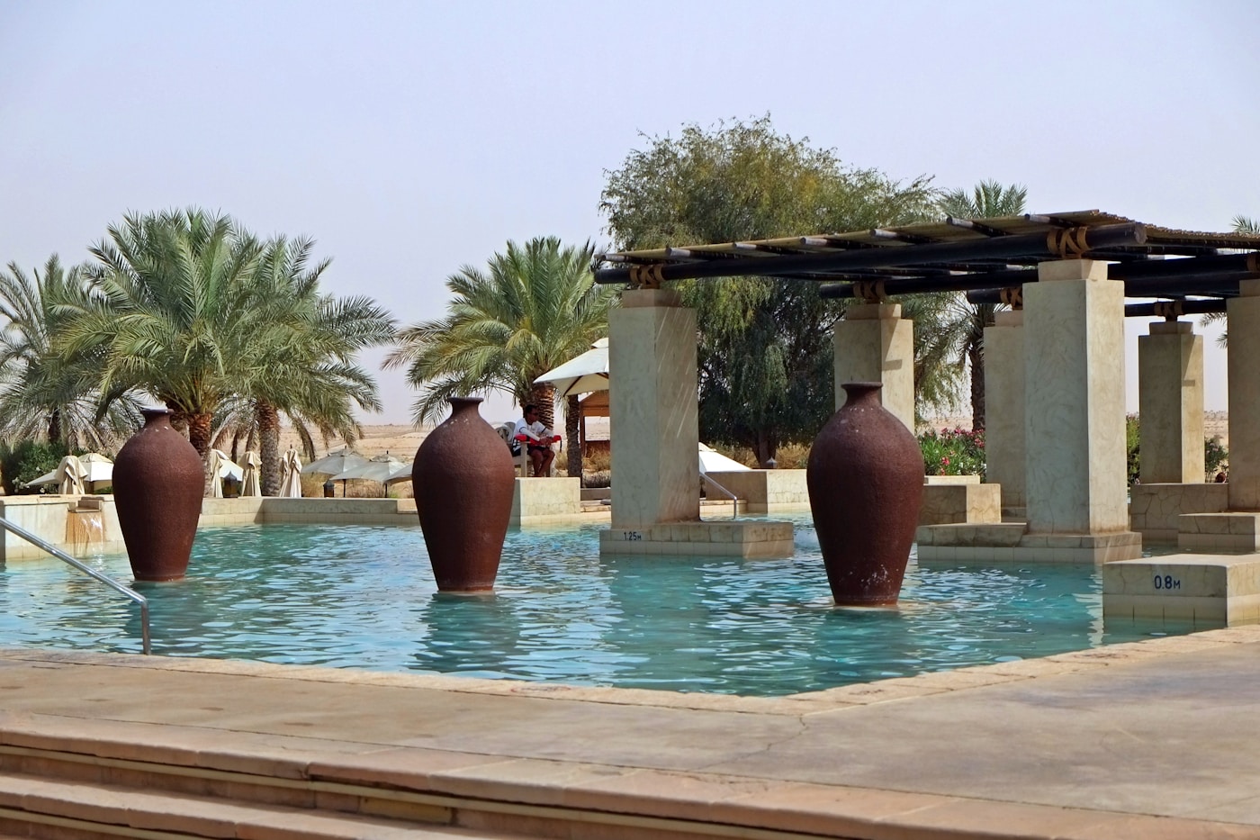 Luxury resort pool with palm trees in Saudi Arabia