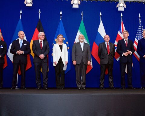 P5+1 foreign ministers and Iranian Foreign Minister Zarif standing with national flags during Iran nuclear negotiations in Lausanne, Switzerland. Photo: US Department of State / Public Domain