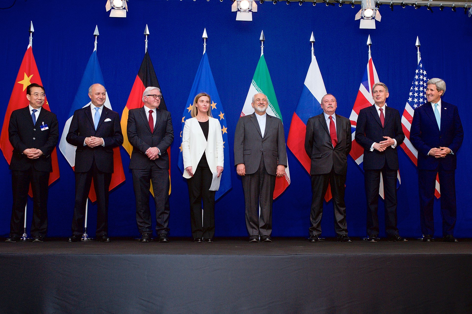 P5+1 foreign ministers and Iranian Foreign Minister Zarif standing with national flags during Iran nuclear negotiations in Lausanne, Switzerland. Photo: US Department of State / Public Domain
