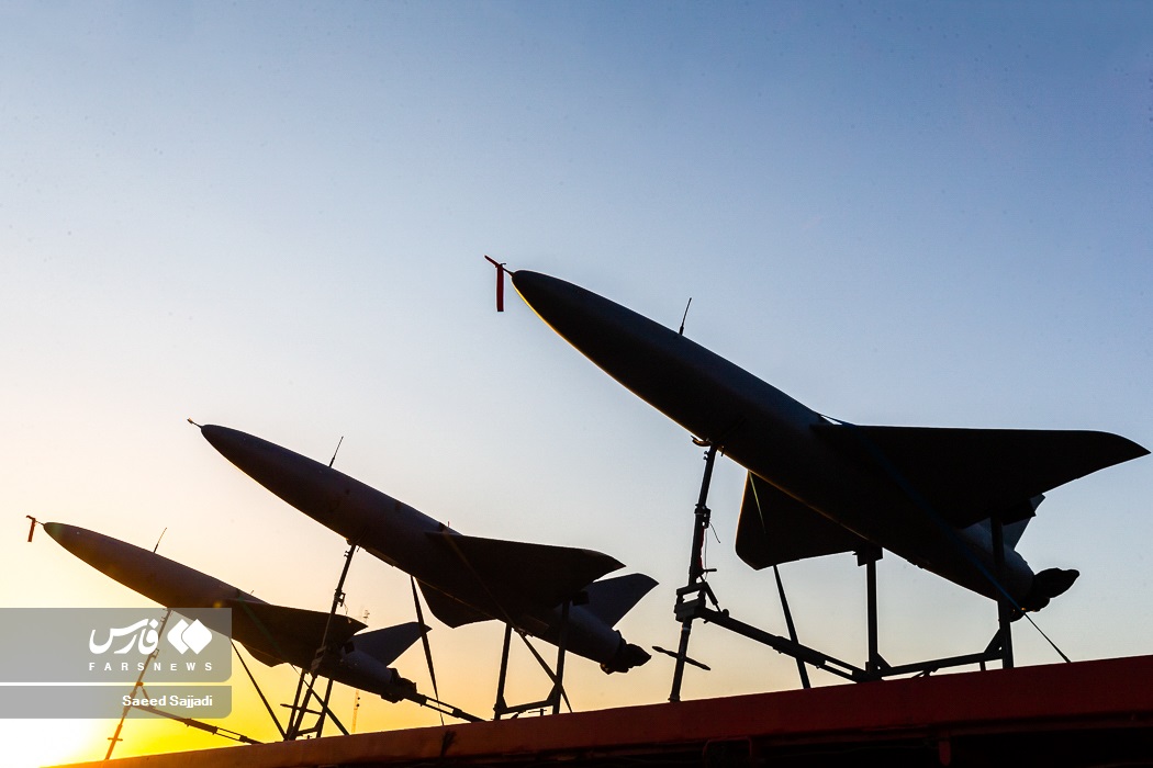 Iranian military drones silhouetted against sunset during IRGC drone exercise in 2022. Photo: Saeed Sajjadi / Wikimedia Commons / CC BY 4.0