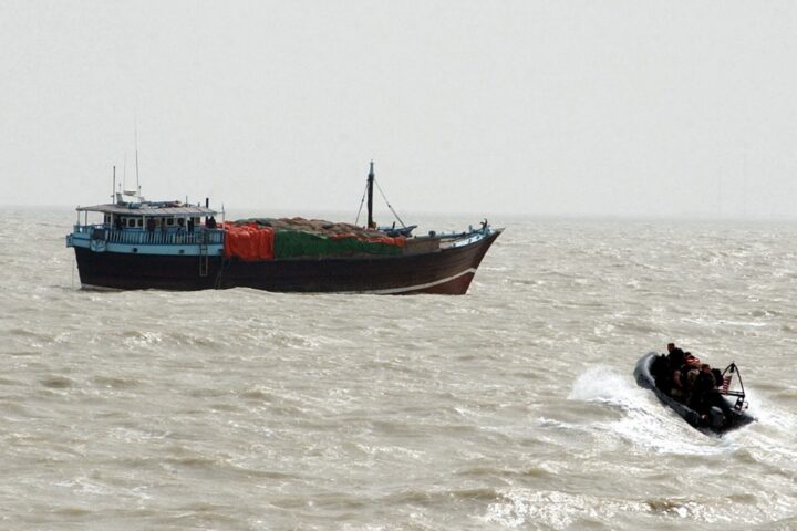 Naval boarding team approaches a cargo vessel in the Arabian Gulf as Iran imposes transit fees on Strait of Hormuz shipping. Photo: US Navy / Public Domain