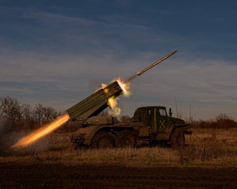 A military rocket launcher fires a missile at dusk, representing Iran IRGC military power and the missile strikes on Gulf states during the 2026 Iran war