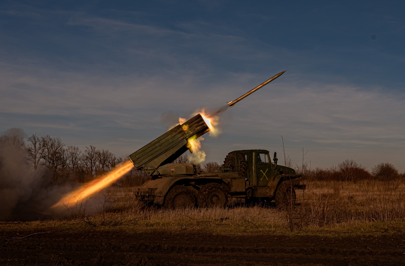 A military rocket launcher fires a missile at dusk, representing Iran IRGC military power and the missile strikes on Gulf states during the 2026 Iran war