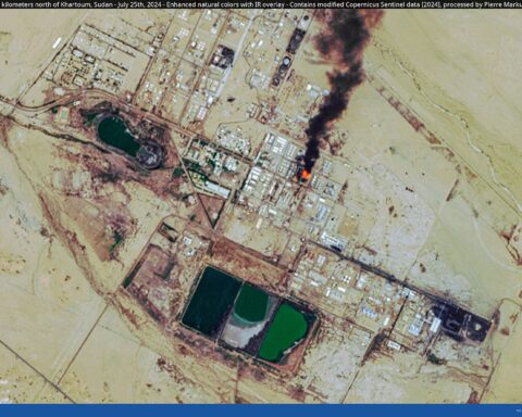 Satellite image showing fire and black smoke rising from an oil refinery complex under attack. Photo: Copernicus Sentinel / CC BY 2.0