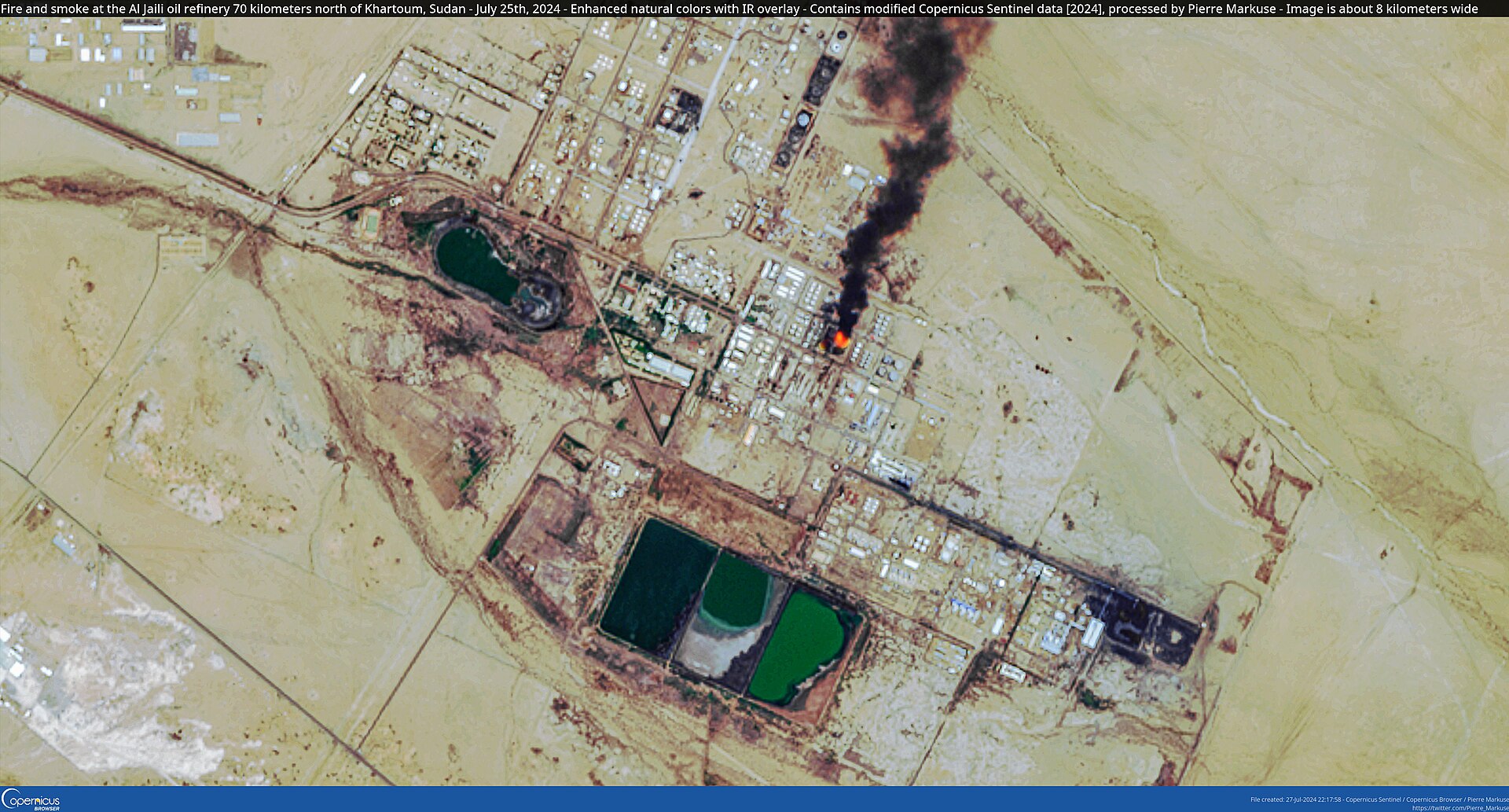 Satellite image showing fire and black smoke rising from an oil refinery complex under attack. Photo: Copernicus Sentinel / CC BY 2.0