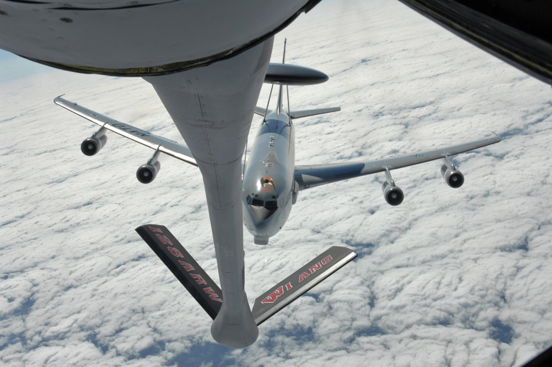 A KC-135 Stratotanker refuels an E-3 Sentry AWACS aircraft during aerial operations over Europe