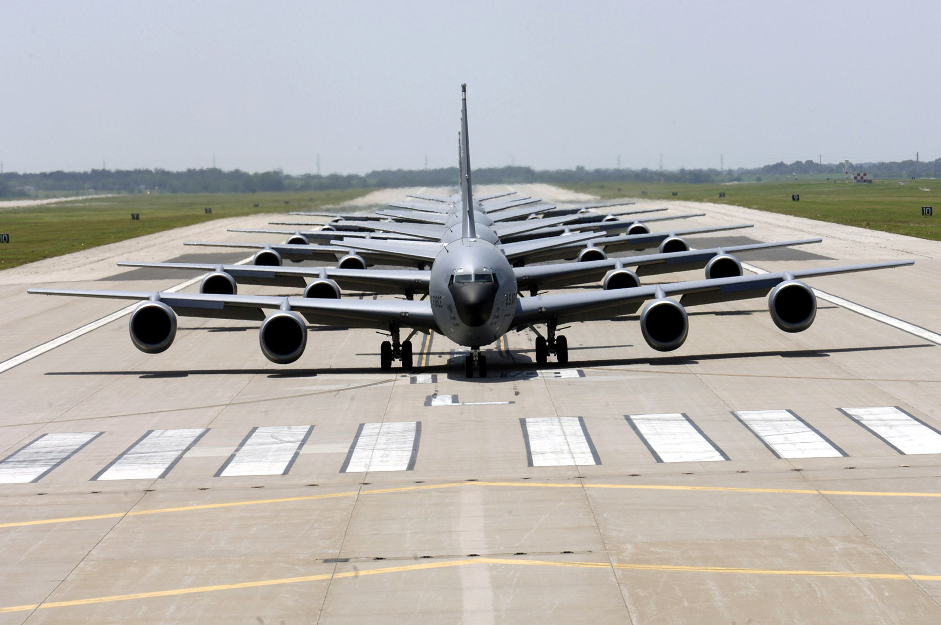U.S. Air Force KC-135 Stratotanker aircraft lined up on a runway in formation, the same type of refueling aircraft damaged by Iranian missile strikes at Prince Sultan Air Base in Saudi Arabia. Photo: U.S. Air Force / Public Domain