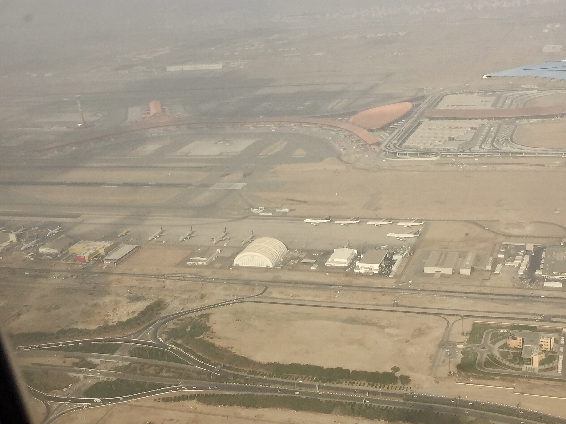 Aerial view of King Abdulaziz International Airport in Jeddah showing terminals and parked aircraft. Photo: Wikimedia Commons / CC BY-SA 4.0