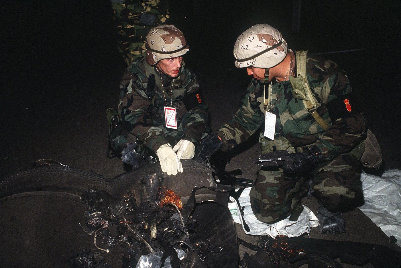 Military explosive ordnance disposal technicians inspect the remains of an intercepted missile in the Persian Gulf region, a scene repeated across Gulf states as air defenses engage Iranian projectiles. Photo: US Department of Defense / Public Domain