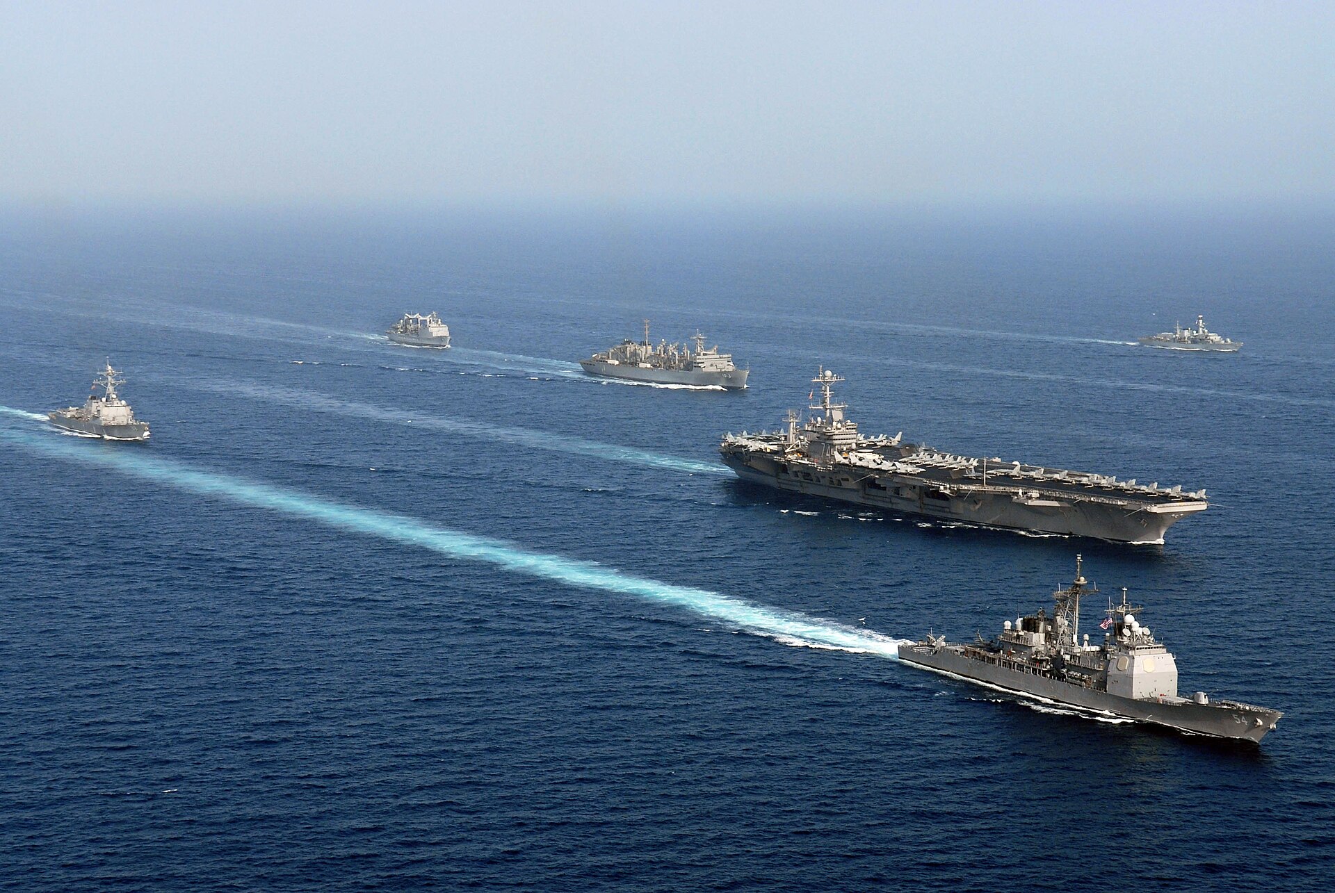 American, French and British warships operating together in the Arabian Sea as part of a multinational naval coalition supporting maritime security operations. Photo: US Navy / Public Domain