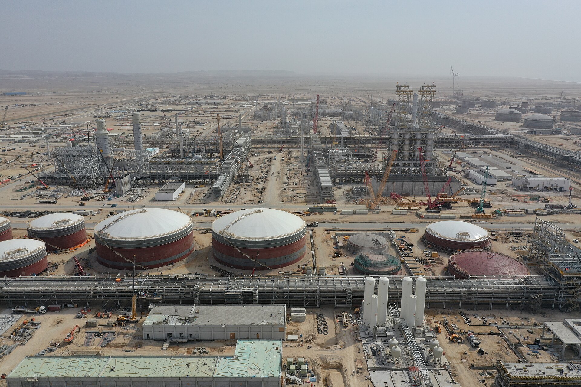 Aerial view of the Duqm oil refinery in Oman, one of many Gulf energy facilities whose output has been disrupted by the 2026 Iran war