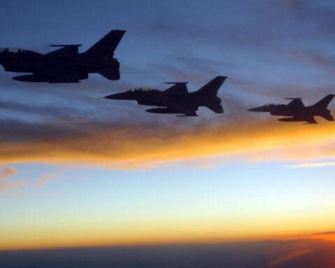 Pakistan Air Force F-16 fighter jets fly in formation at sunset, representing the military dimension of the Pakistan-Saudi Arabia Strategic Mutual Defence Agreement. Photo: US Air Force / Public Domain