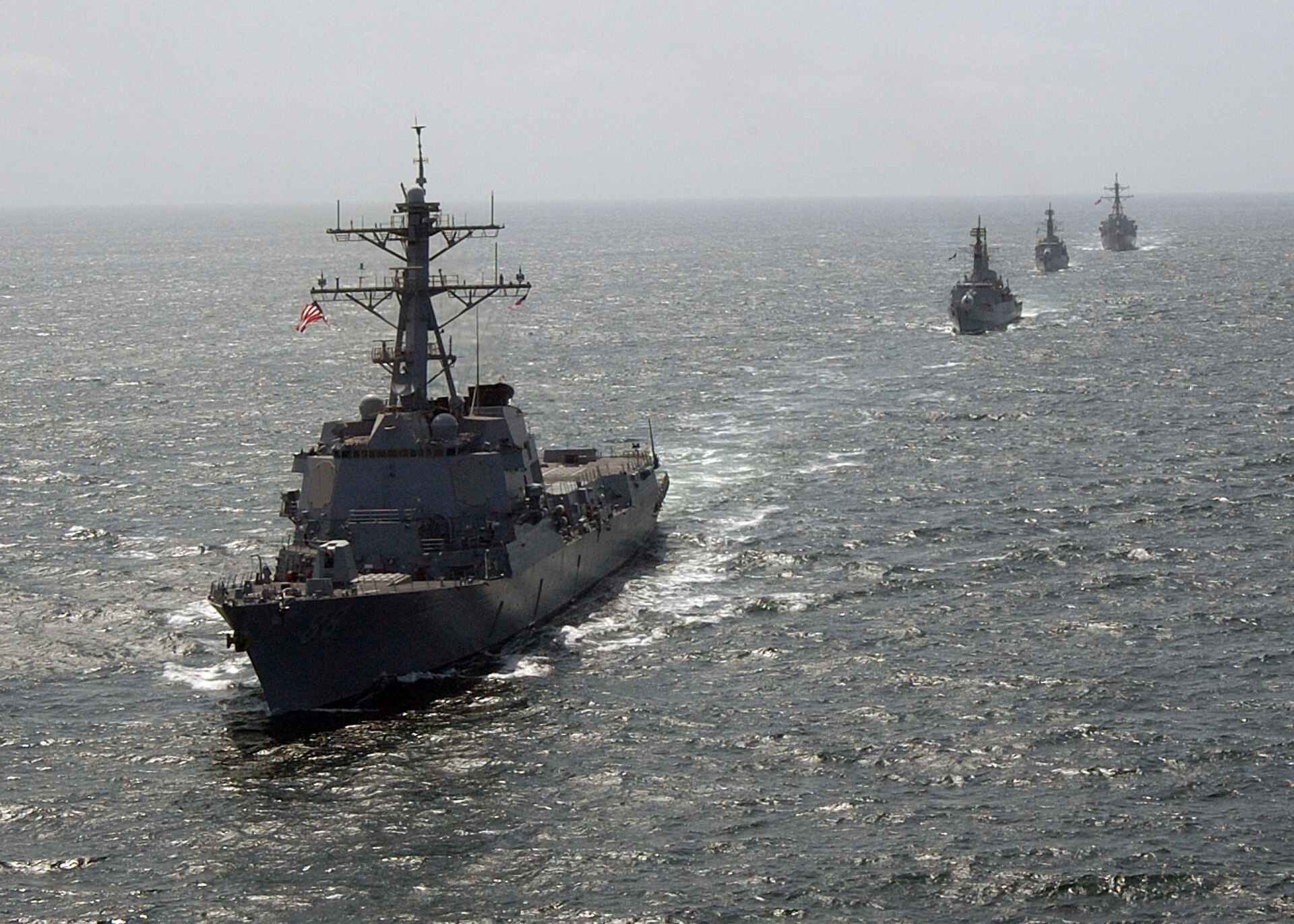 US and Pakistani Navy destroyers in formation during joint exercise Inspired Siren demonstrating military cooperation. Photo: US Navy / Public Domain