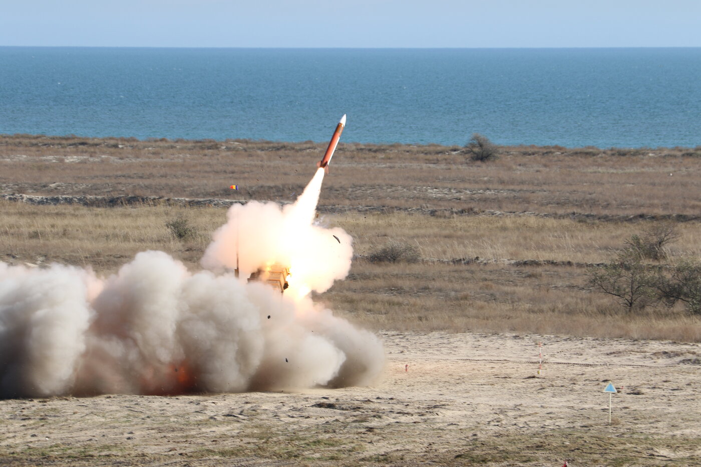 A Patriot missile interceptor launches during a live-fire exercise, trailing smoke and flame. Saudi air defense crews have conducted dozens of similar intercepts against Iranian drones and missiles since March 2026. Photo: US Army / Public Domain