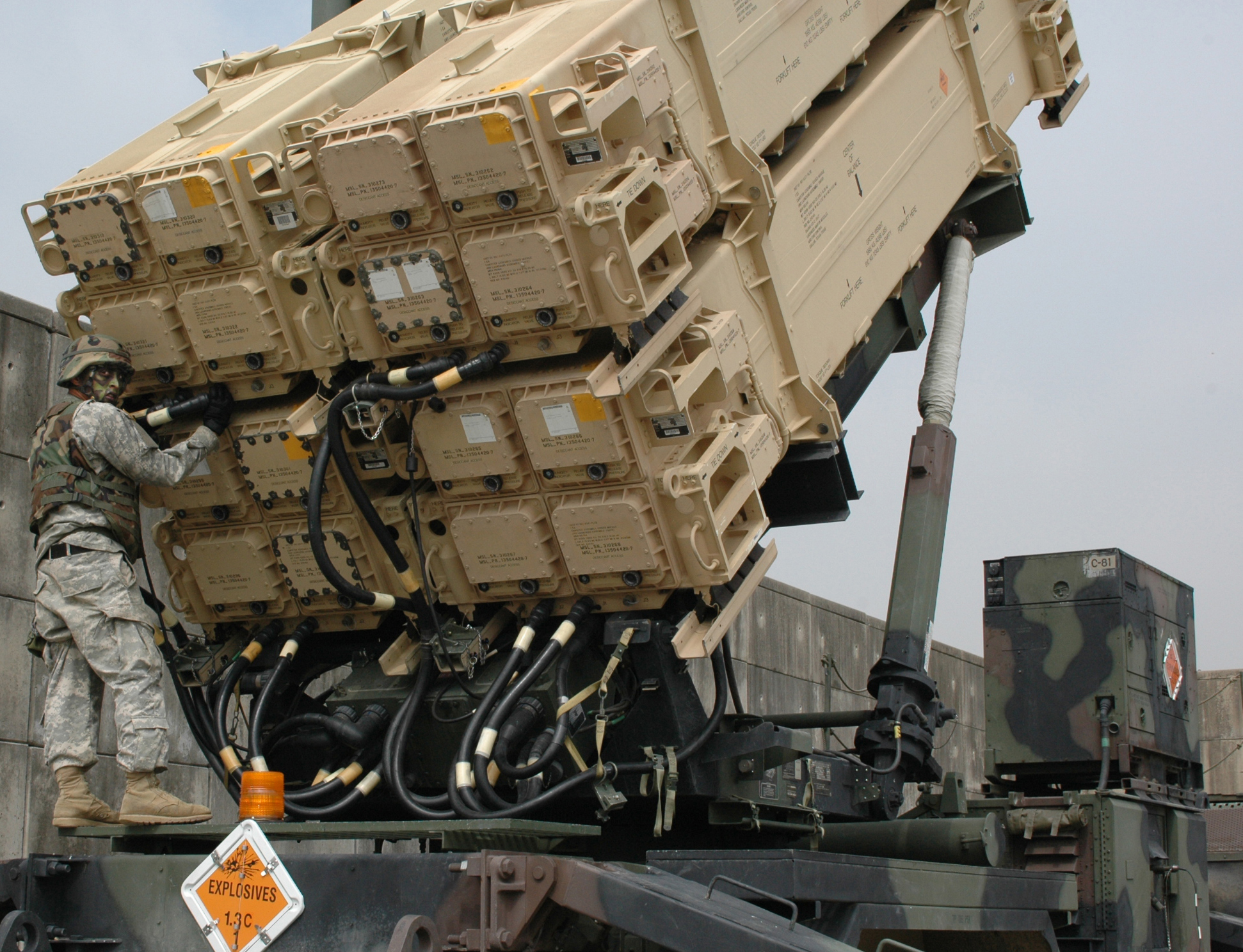 A US soldier conducts maintenance on a Patriot missile defense launcher. Interceptor shortages have emerged as a critical vulnerability in the Gulf air defense campaign. Photo: US Army / Public Domain