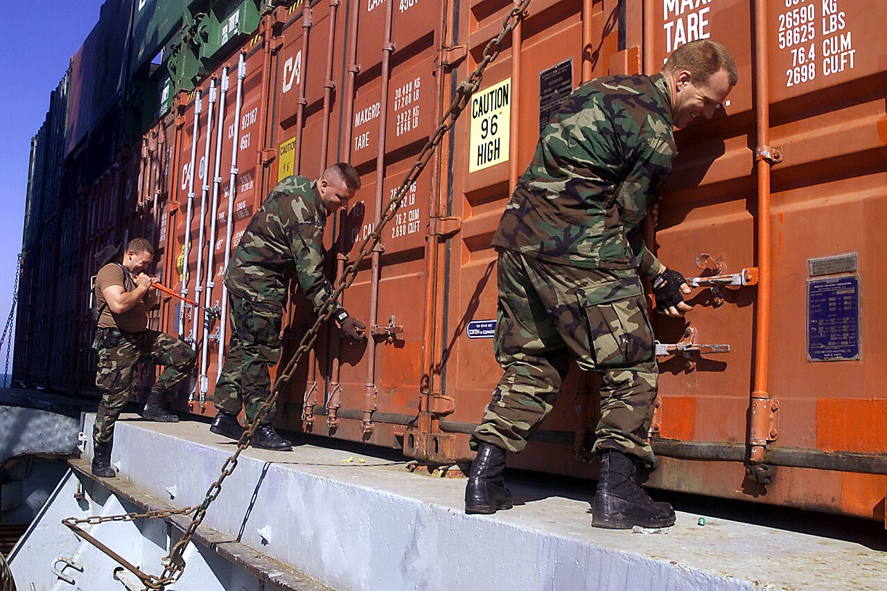 U.S. Navy personnel inspect cargo containers aboard a vessel in the Persian Gulf during wartime maritime interdiction operations. Photo: U.S. Navy / Public Domain
