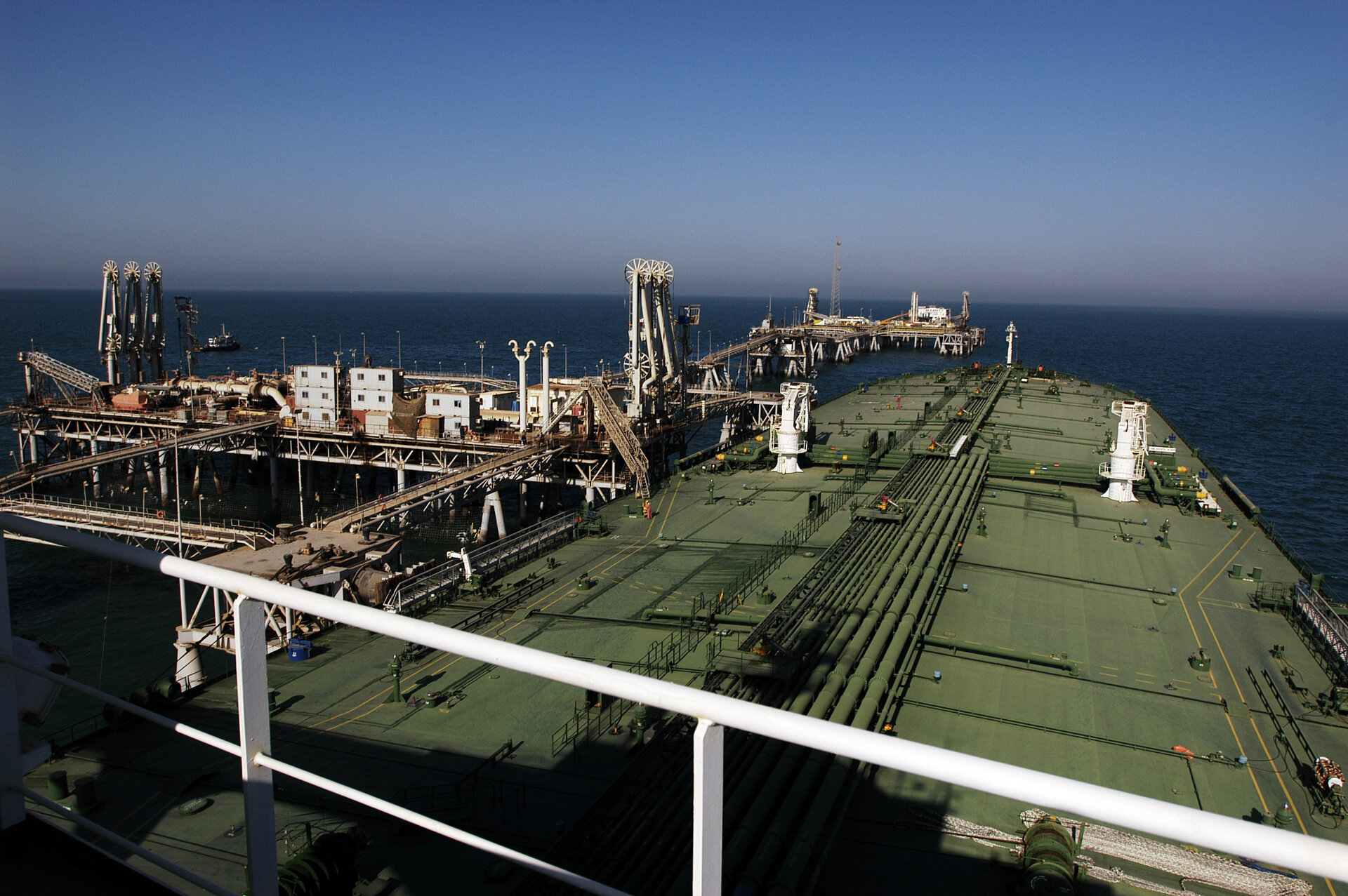 Oil tanker loading crude at the Al Basrah Oil Terminal in the Persian Gulf, representing the pipeline and export infrastructure that determines which Gulf economies survive the Hormuz blockade