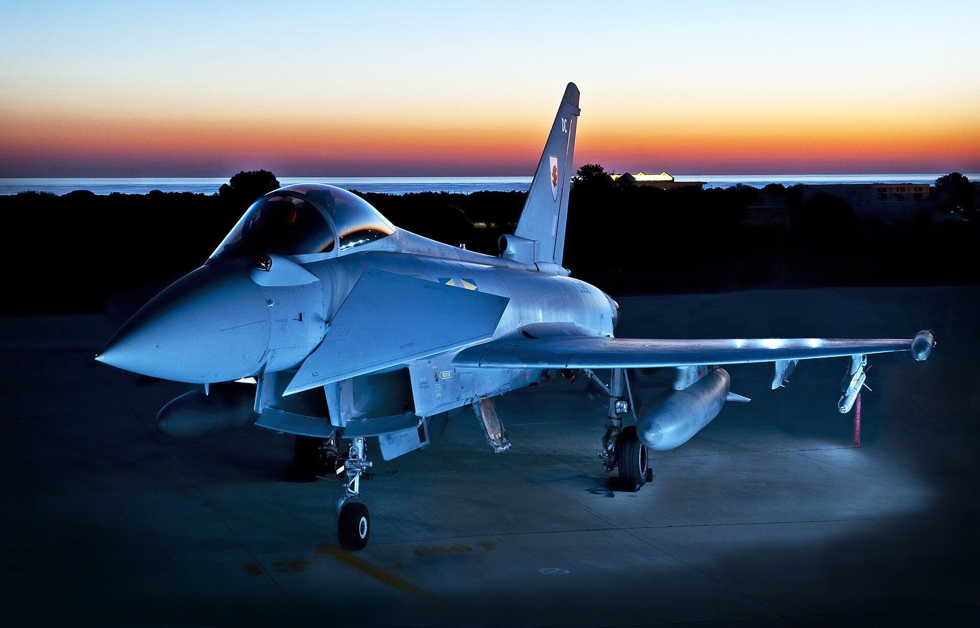 RAF Typhoon fighter jet on the tarmac at RAF Akrotiri, Cyprus, at dusk. Britain is deploying additional Typhoons to the Gulf to support Saudi Arabia defense. Photo: UK Ministry of Defence / OGL v1.0