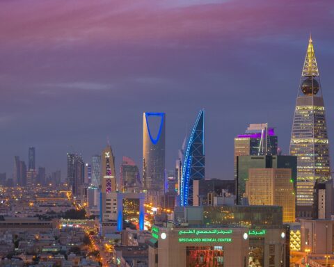Riyadh skyline at dusk showing Kingdom Tower and Al Faisaliyah Tower as millions shelter during Iranian drone strikes