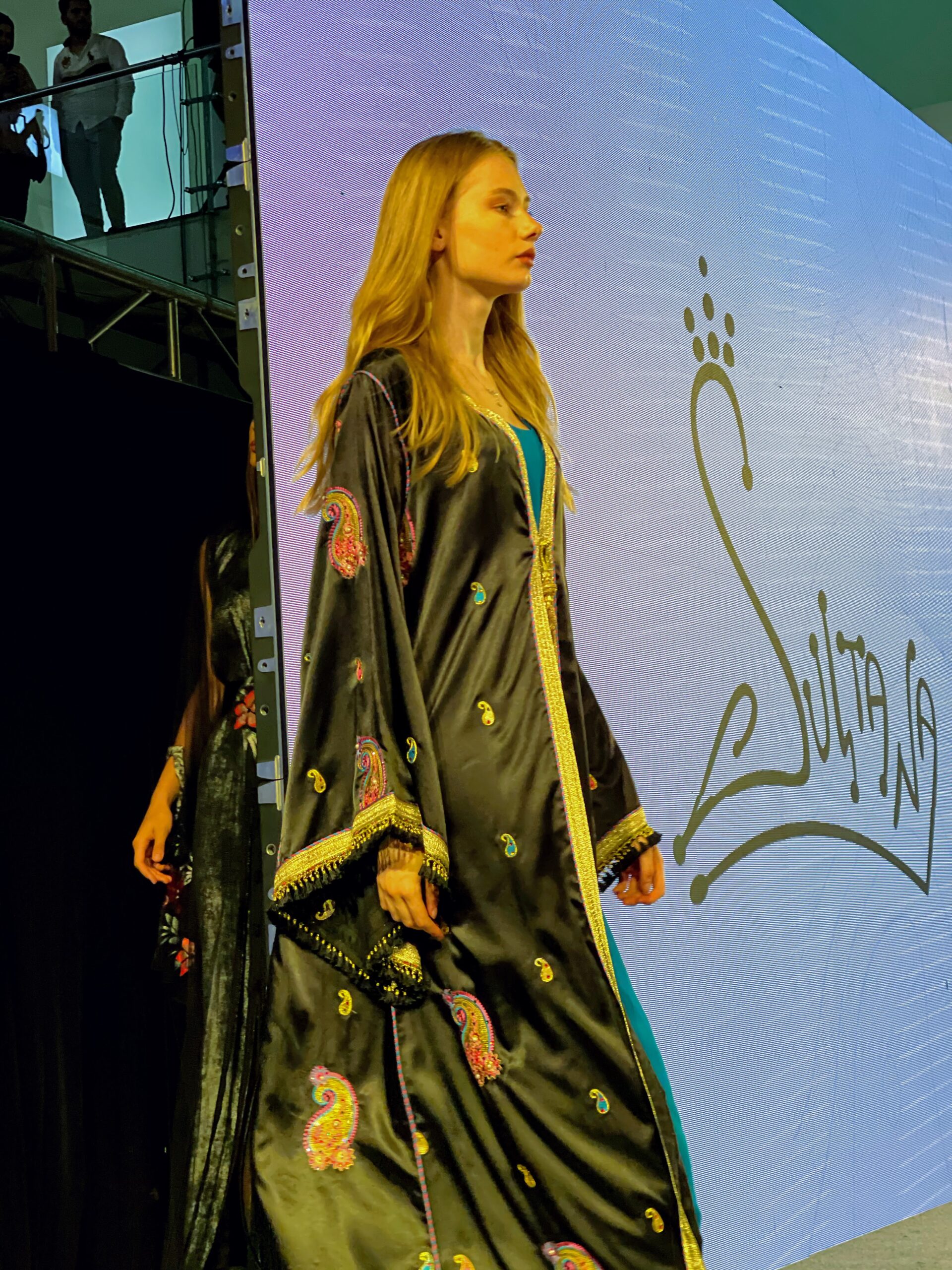 Woman wearing traditional black abaya dress in Saudi Arabia