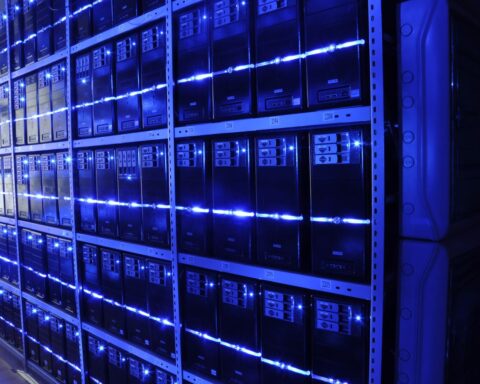Server racks with blue LED indicators inside a modern data center facility, illustrating the infrastructure behind Saudi Arabias push to become a global AI powerhouse. Photo: Wikimedia Commons / CC BY-SA 3.0