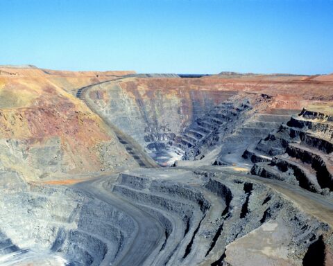 Open-pit gold mine showing terraced excavation operations typical of large-scale mineral extraction. Photo: CSIRO / CC BY 3.0