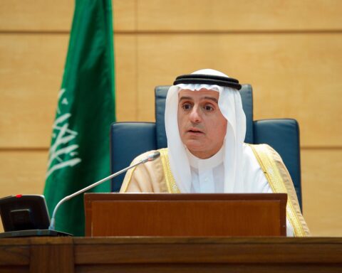 Saudi Foreign Minister Adel al-Jubeir addresses reporters at a diplomatic press conference in Jeddah, with the Saudi flag behind him. Photo: US State Department / Public Domain