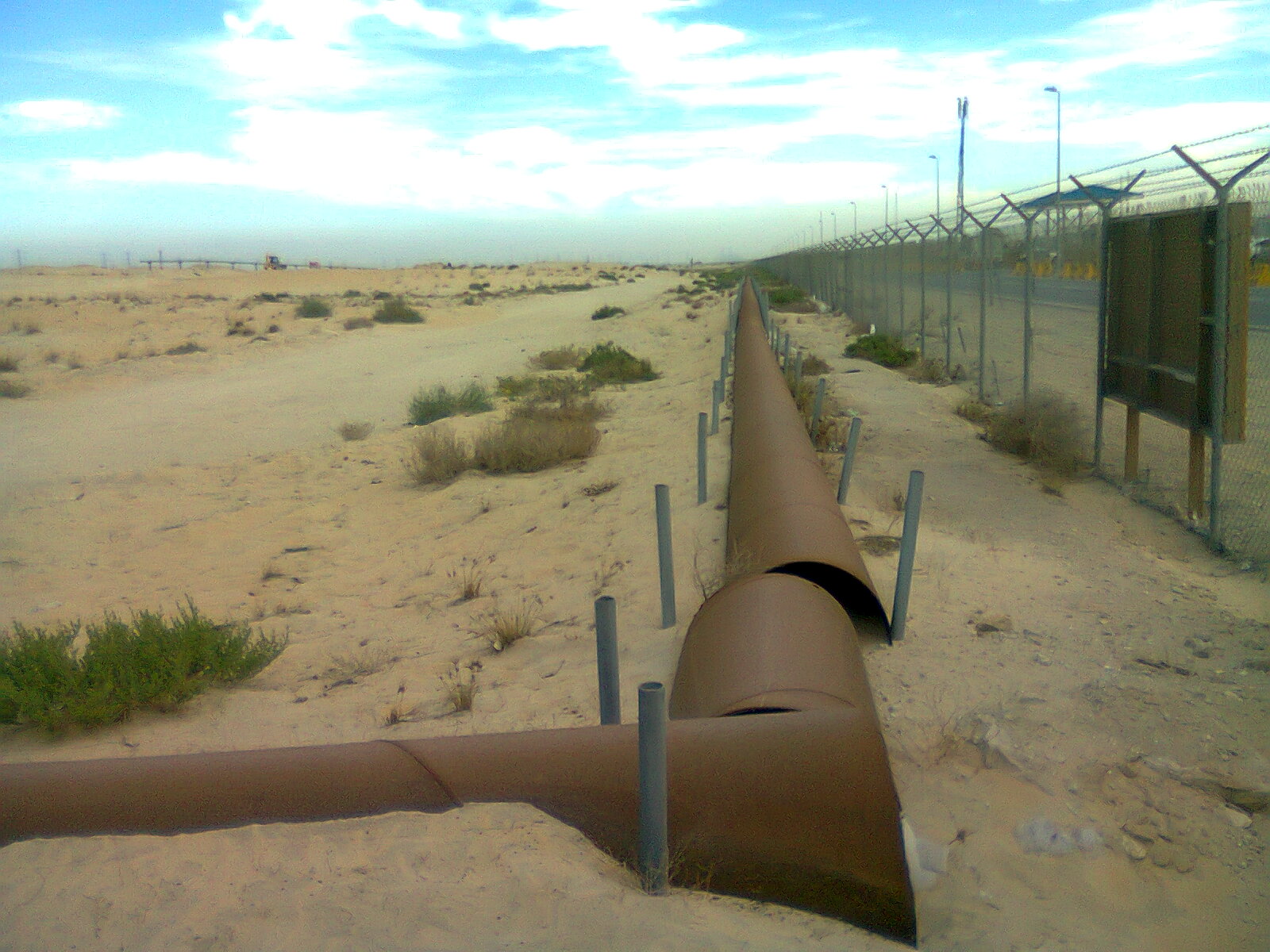 Oil pipeline stretching across the Saudi Arabian desert near Jubail industrial city in the Eastern Province
