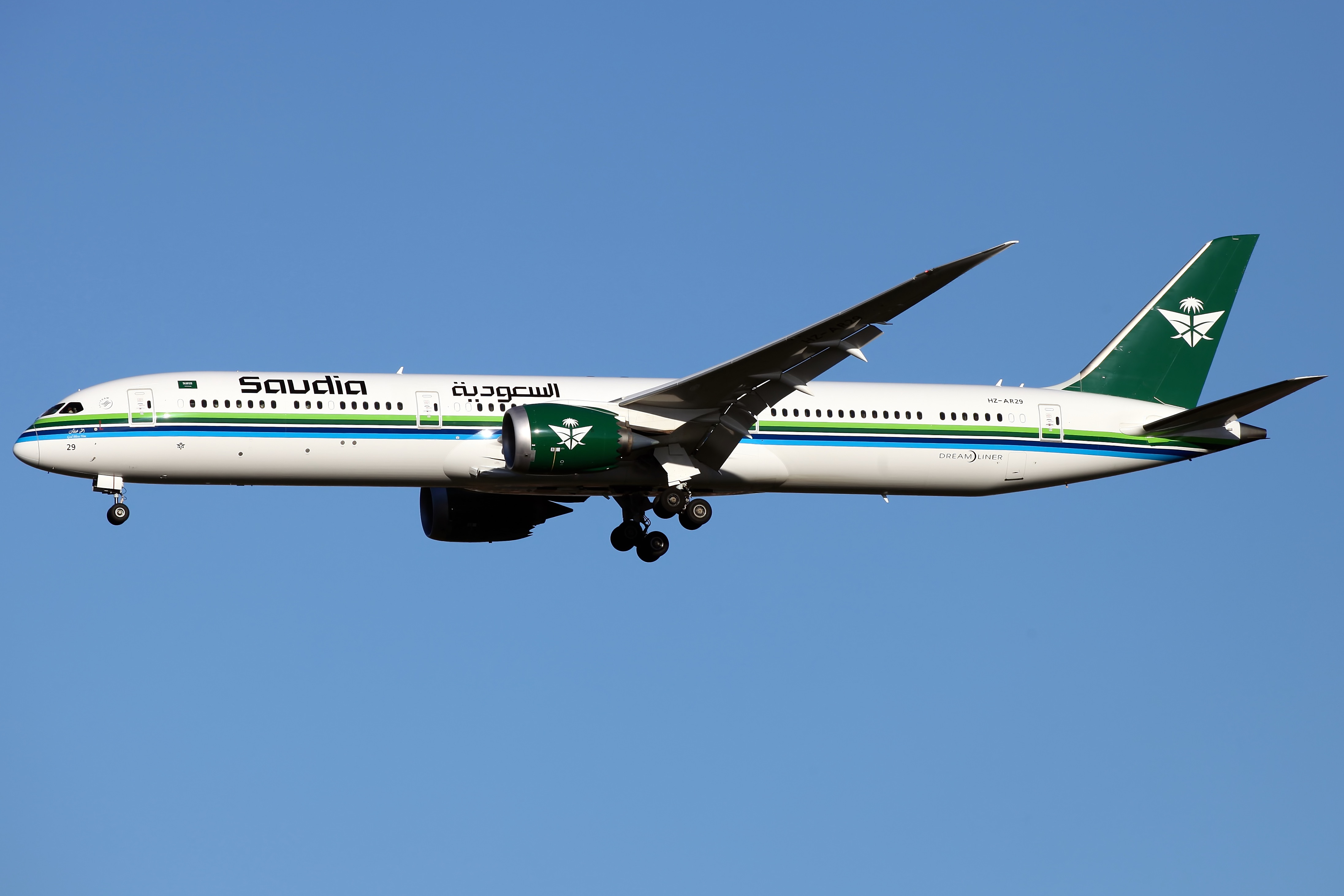 A Saudia Boeing 787-10 Dreamliner in retro livery on approach. The Saudi national carrier recorded 71 flight delays in a single day as regional airspace closures disrupted operations.