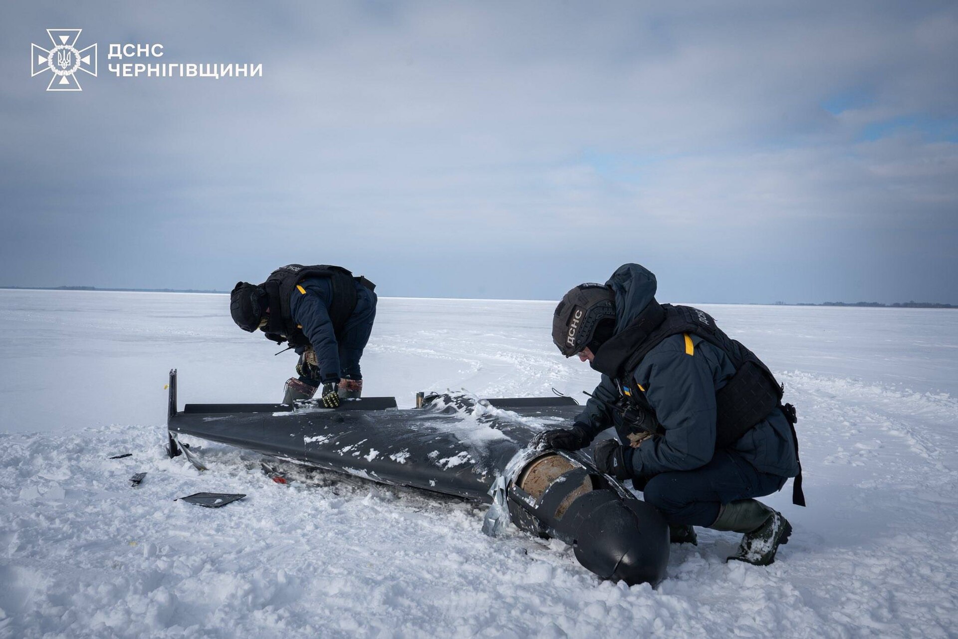 Ukrainian emergency services examine the remains of an Iranian-made Shahed drone recovered in Chernihiv Oblast in February 2026, the same type of drone now threatening Saudi oil infrastructure.