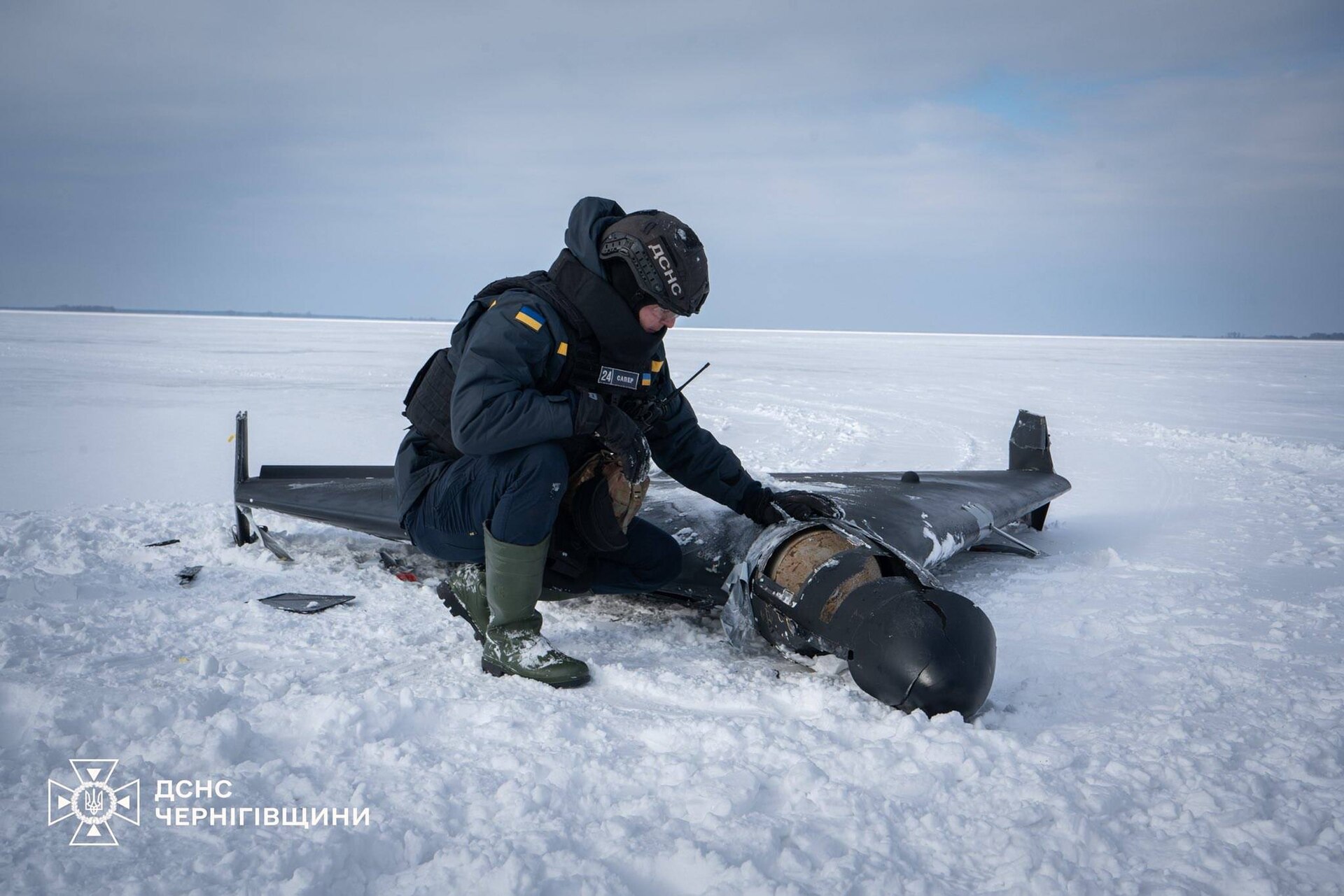 A Ukrainian emergency services technician examines the wreckage of an Iranian-made Shahed drone in Chernihiv Oblast, February 2026. The same drone type targets Saudi oil infrastructure. Photo: DSNS Ukraine / CC BY 4.0