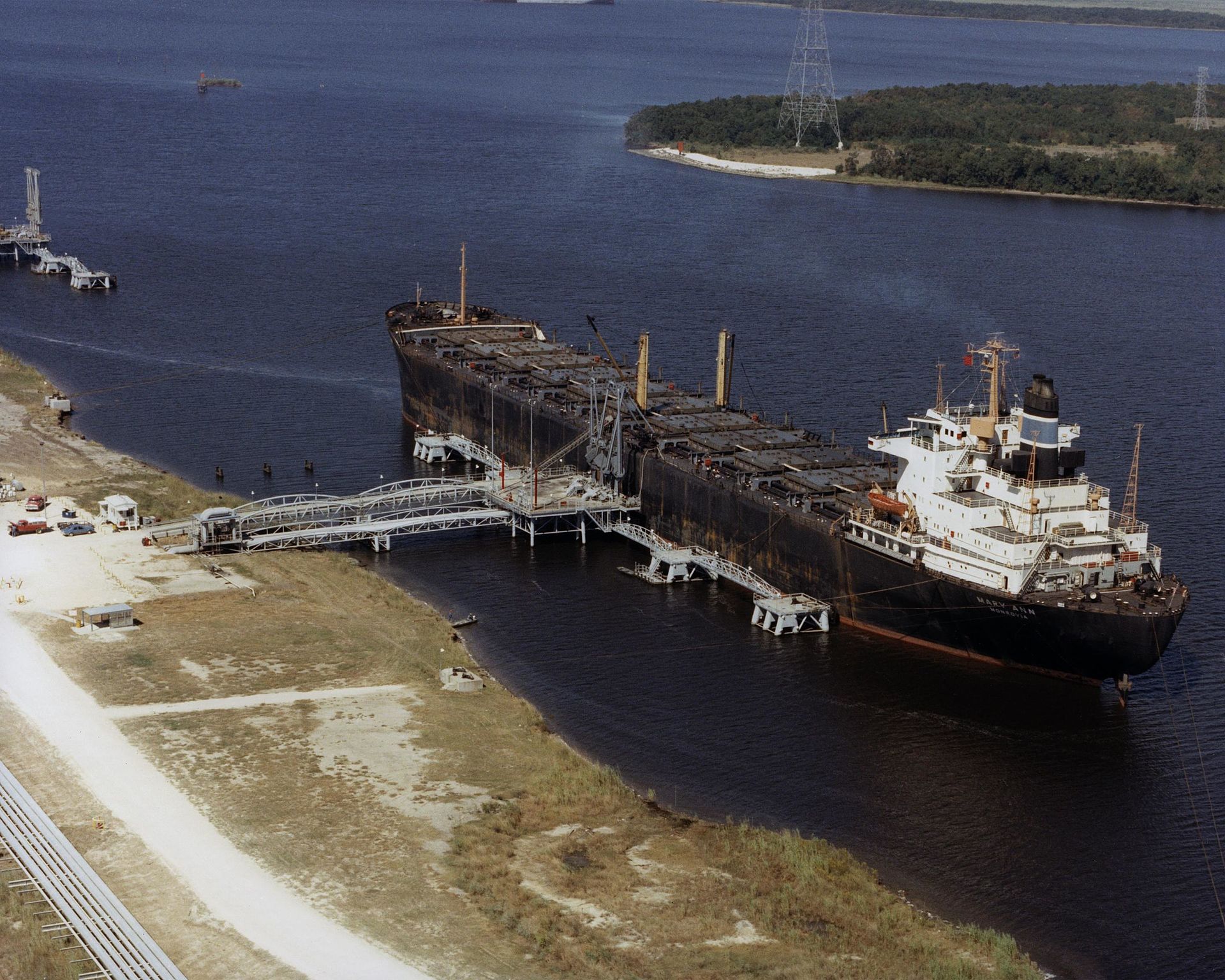 Aerial view of oil tankers at a US Strategic Petroleum Reserve facility, part of the global emergency oil stockpile being depleted during the 2026 Iran war. Photo: US Department of Energy / Public Domain